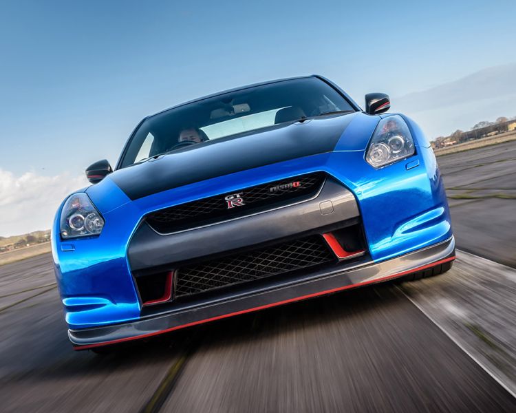 blue sports car on a race track for a driving experience day