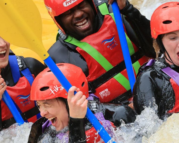 Group in life jackets and helmets min