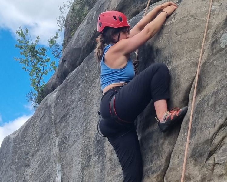 A woman climbing at Intro to Climbing Hatt Adventures