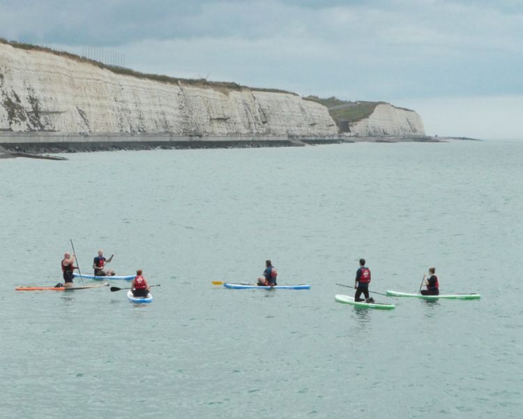 A group of paddle boarders at SUP Hatt Adventures