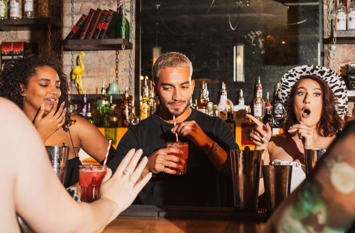 a bartender testing drinks