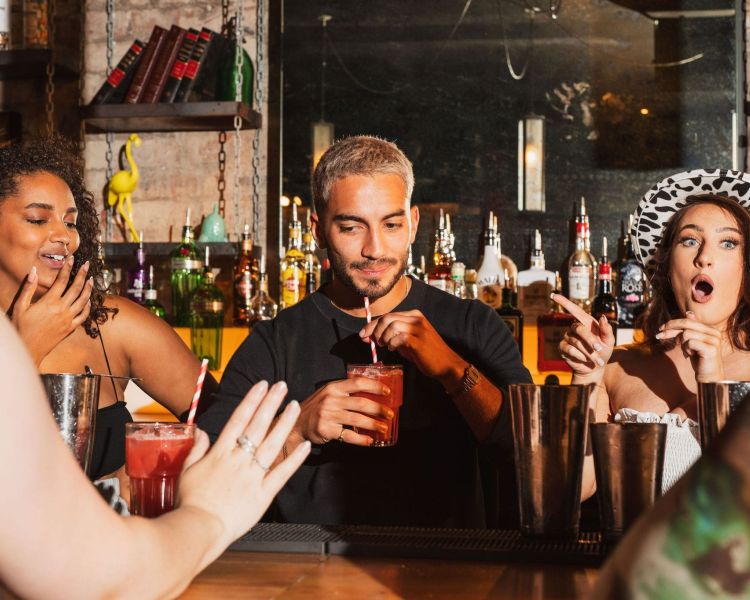 a bartender testing drinks