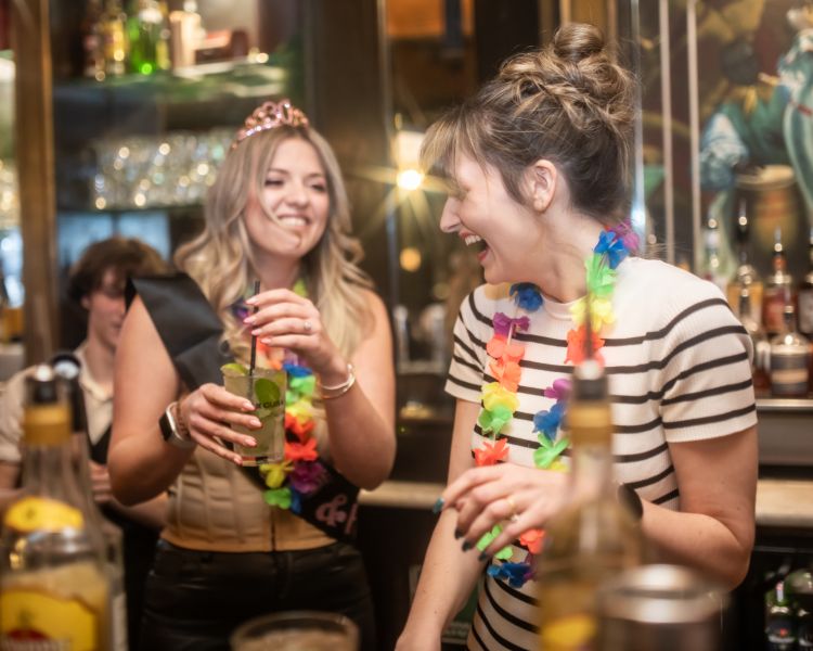 two ladies tasting cocktails on a cocktail masterclass at revolucion de cuba