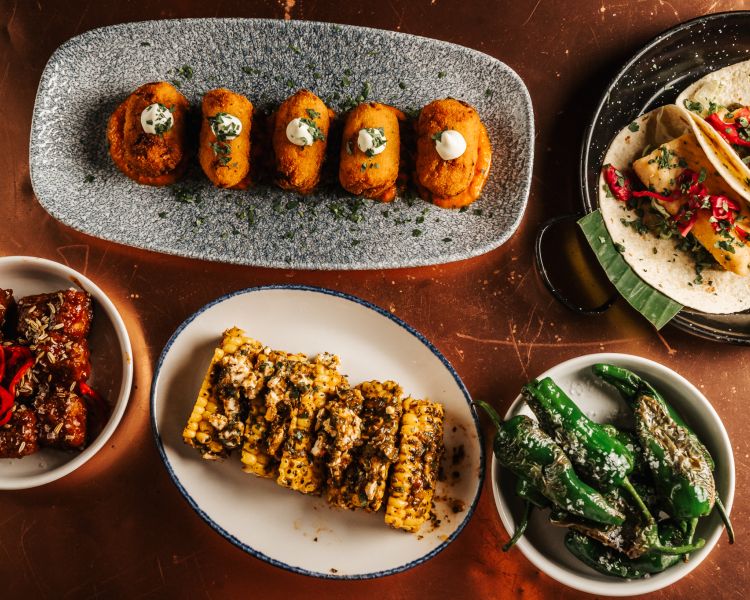 plates of cuban inspired tapas on a tapas and cocktails experience at revolucion de cuba