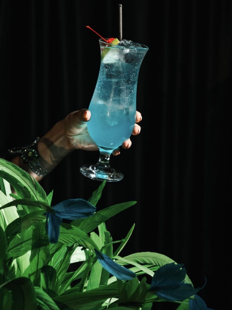 a blue cocktail for a tapas and cocktails experience at revolucion de cuba