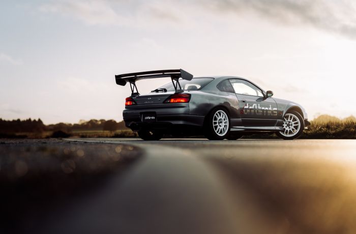 a grey nissan silvia s15 on the track for a drift legends driving experience day