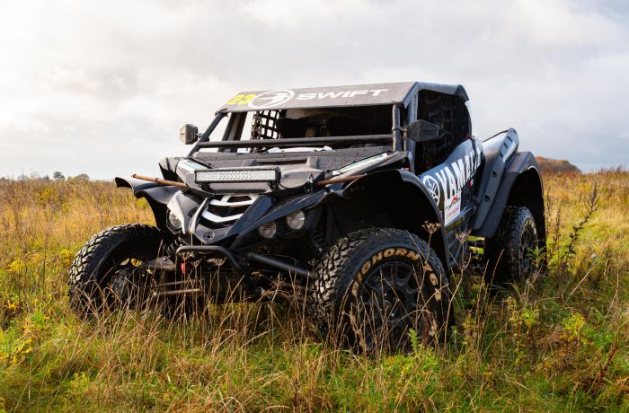 a yamaha xyz1 000r dakar rally prepared yamaha on a dirt track for a jump and dirt driving experience