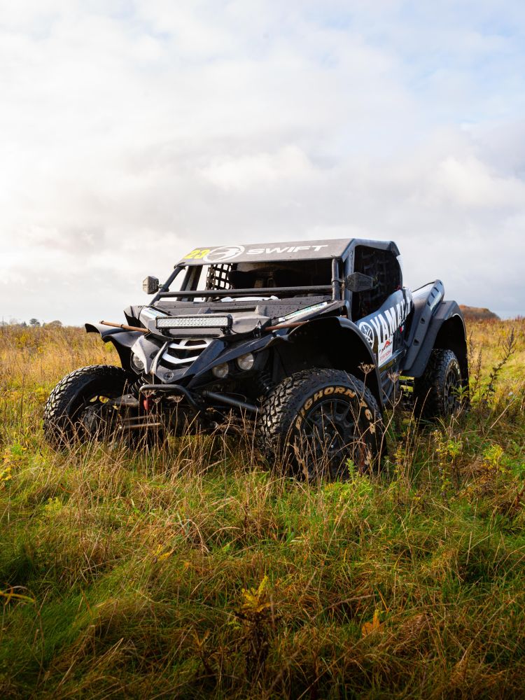 a yamaha xyz1 000r dakar rally prepared yamaha on a dirt track for a jump and dirt driving experience