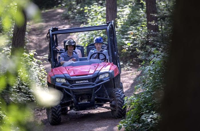 A young driver and instructor on the utility terrain vehicle experience 2