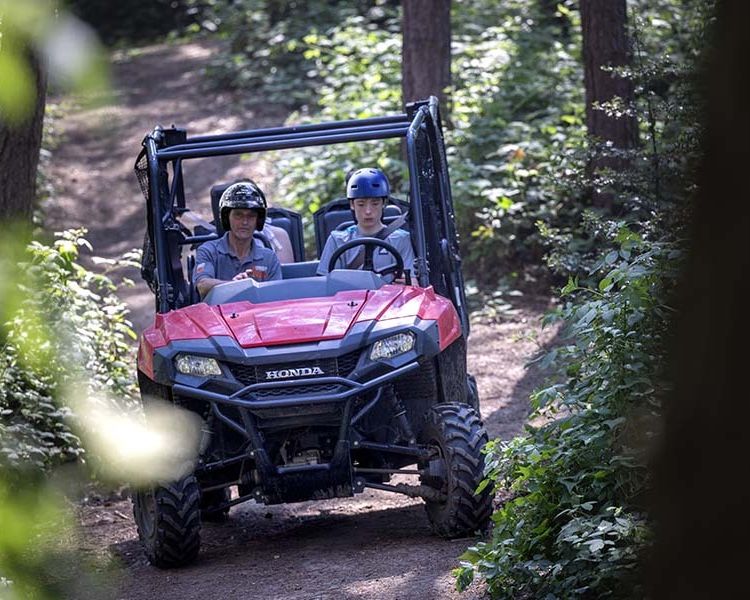 A young driver and instructor on the utility terrain vehicle experience 2