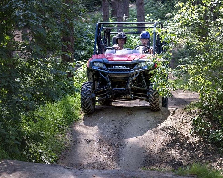 A young driver and instructor on the utility terrain vehicle experience