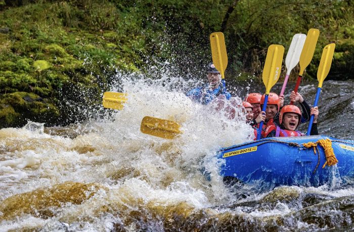 a group on a private whitewater rafting experience in wales
