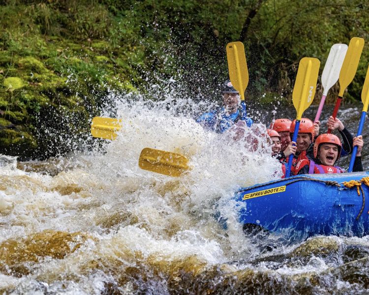 a group on a private whitewater rafting experience in wales