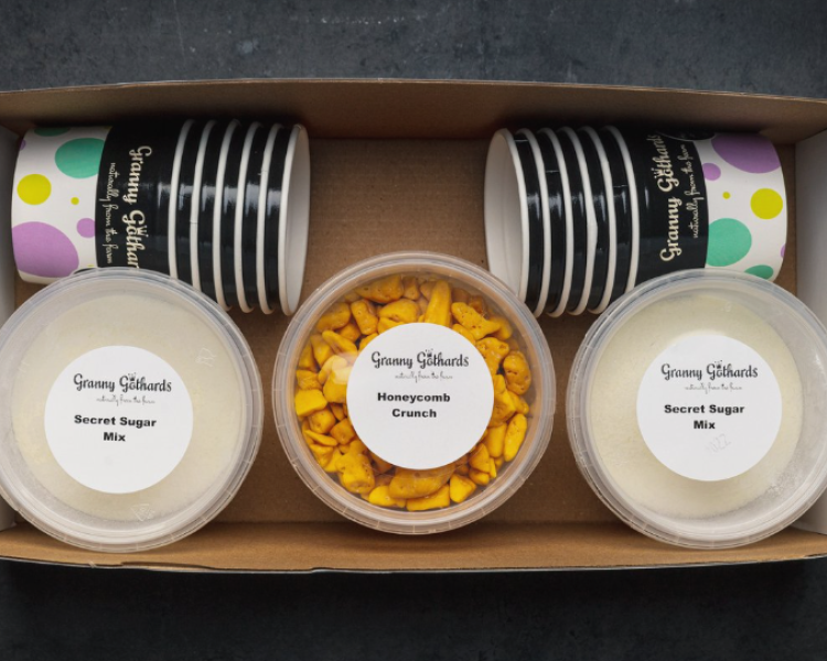 an ice cream making kit in a box including pots, toppings and ice-cream