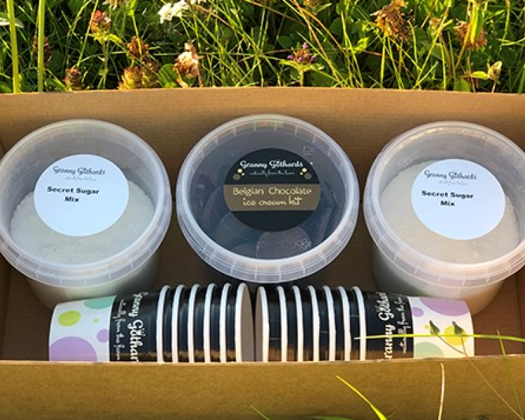 an ice cream making kit in a box including pots, toppings and ice-cream