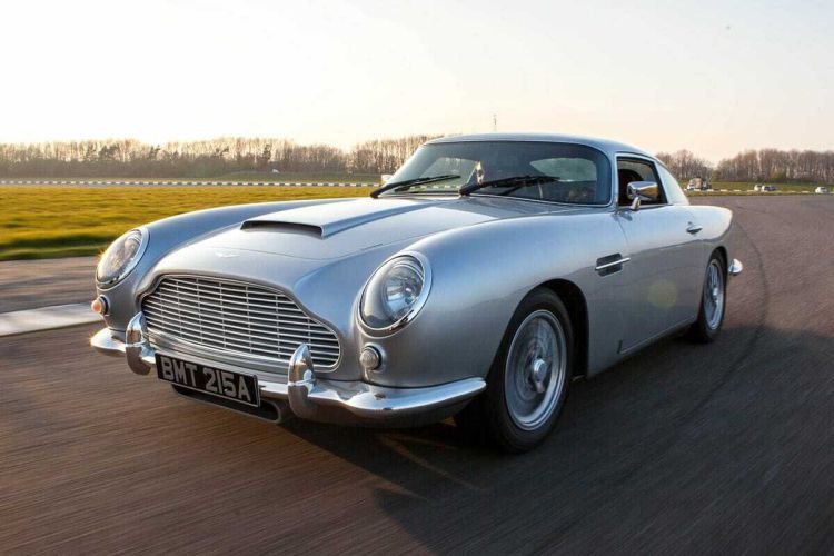 a silver vintage sports car on a race track as part of a movie cars driving experience day