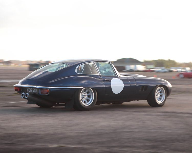 a jaguar e type sports car on a track as part of a driving experience day