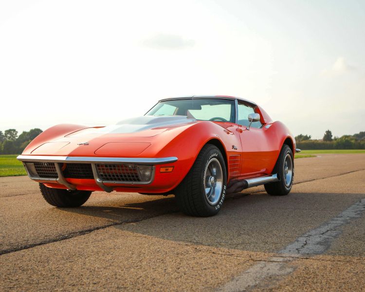 a red vintage sports car on a track as part of a driving experience day