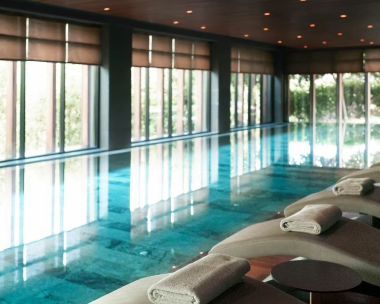 Swimming pool with loungers