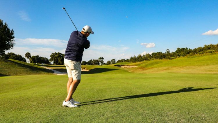 A man playing golf on a golf course