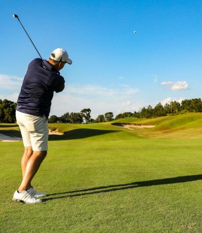 A man playing golf on a golf course