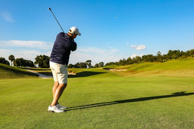 A man playing golf on a golf course