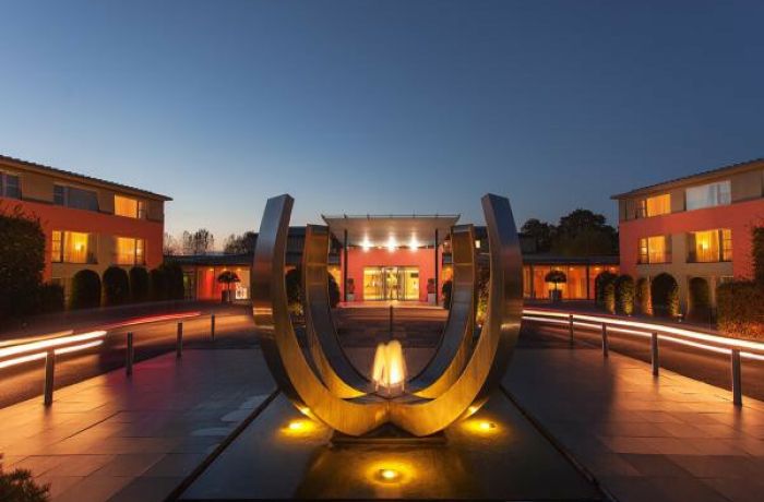 the sculpture outside the crowne plaza marlow hotel lit up at night