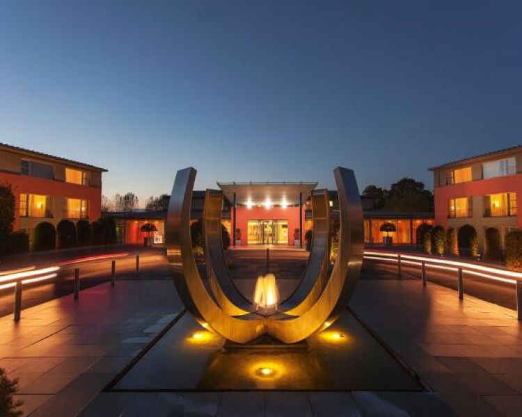 the sculpture outside the crowne plaza marlow hotel lit up at night