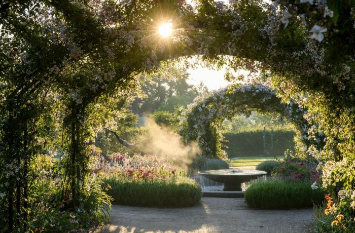 the gardens at rhs wisley in full bloom on a summers day