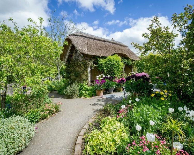 the potager and cottage garden with thatched summer house at rhs rosemoor in devon