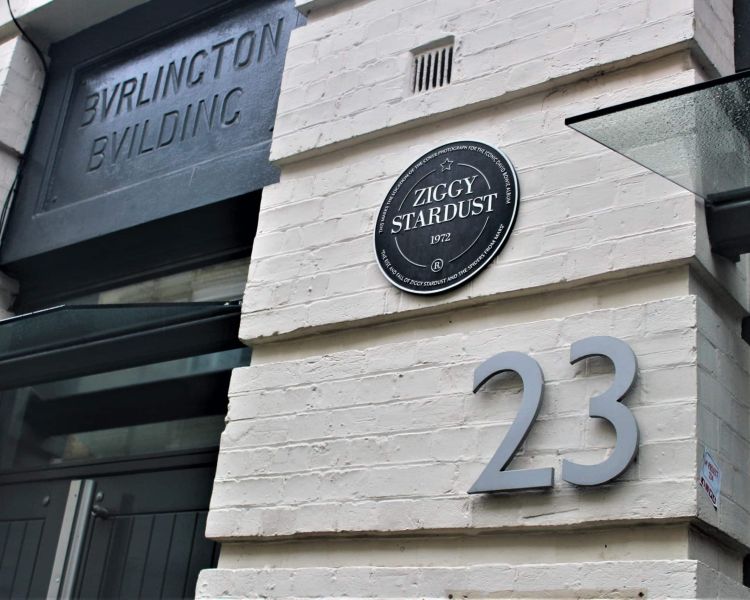 black plaque on a building for ziggy stardust seen on the david bowie tour in london