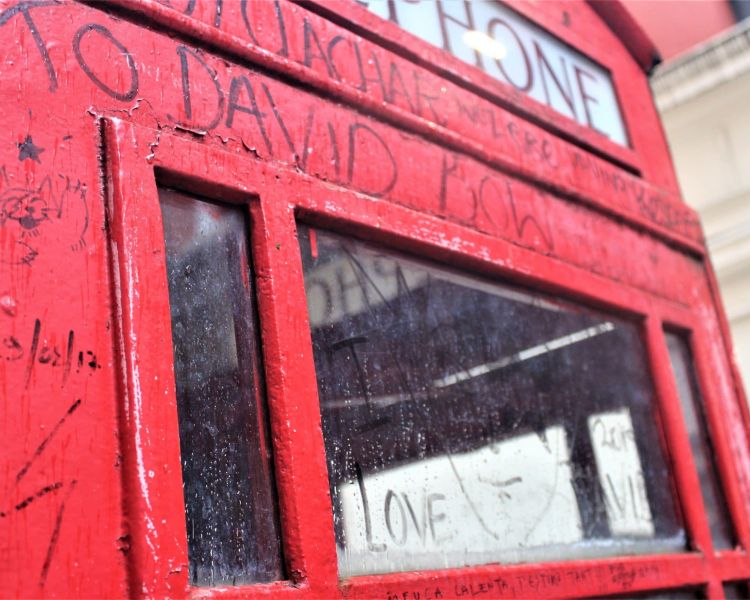 a graffitied phone box seen on the david bowie tour in london