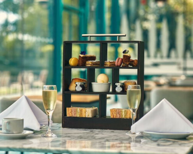 afternoon tea set up on a table at the crowne plaza hotel in marlow