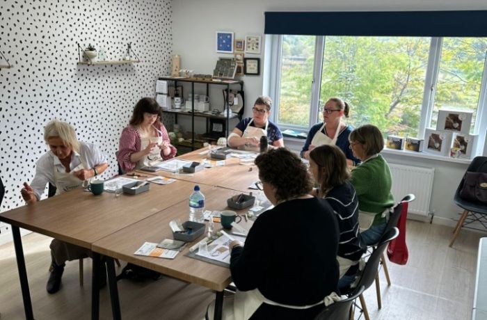 people working at a table on a silver clay workshop in ossett west yorkshire