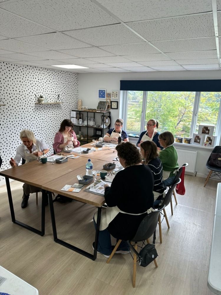 people working at a table on a silver clay workshop in ossett west yorkshire