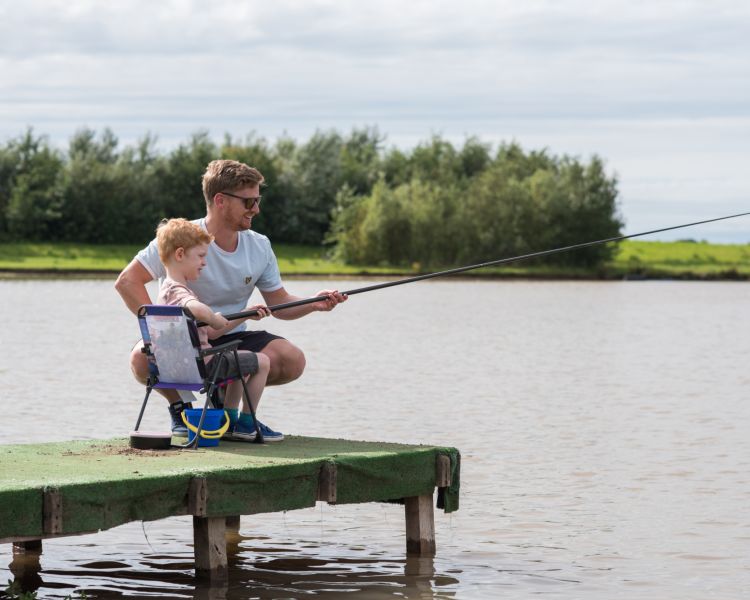 Father and son river fishing