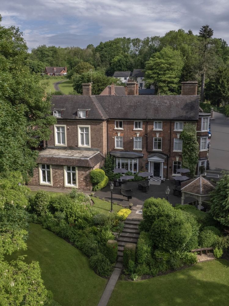 a view of a country hotel hotel with it's gardens in ironbridge shropshire
