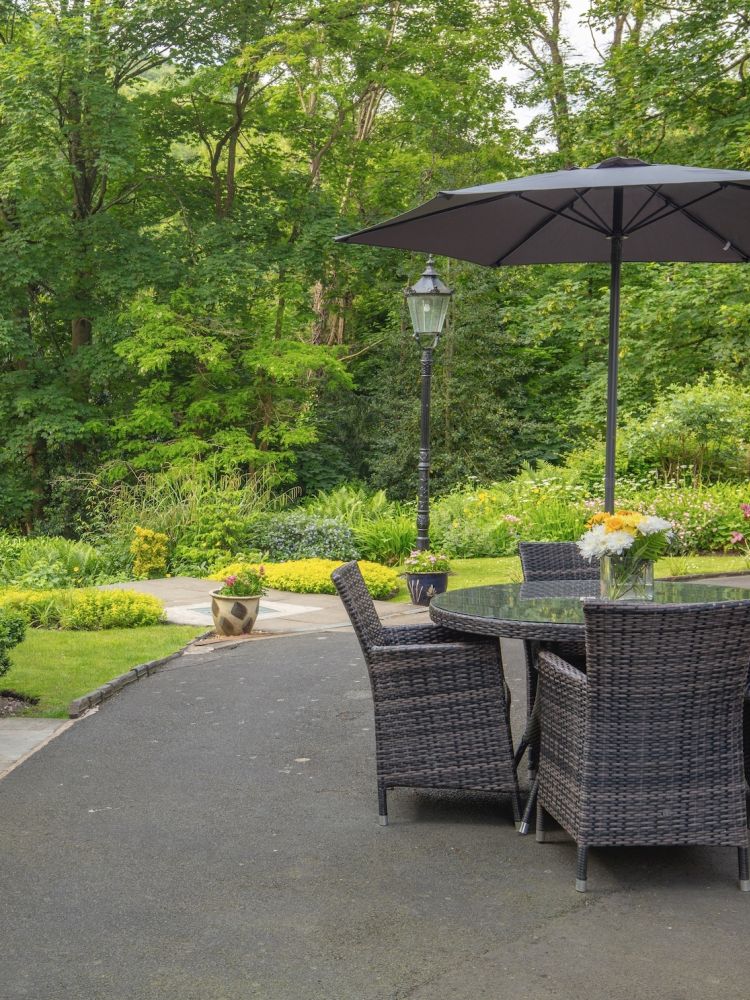 the outside terrace area of a hotel in ironbridge in shropshire