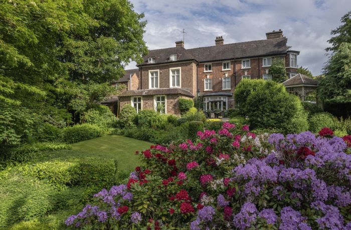 a view of a country hotel with its gardens in bloom in ironbridge in shropshire