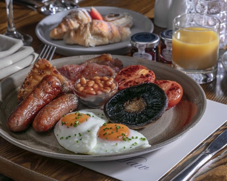 a cooked full english breakfast plated up at a country hotel in ironbridge in shropshire