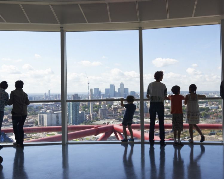 people looking out over london from the viewing platform of the arcelormittal orbit 360