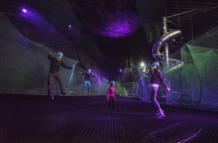 people bouncing on the trampolines underground at zip worlds bounce below