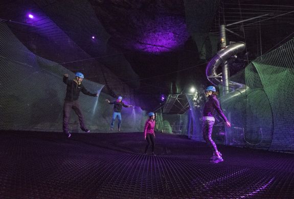 people bouncing on the trampolines underground at zip worlds bounce below