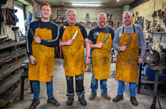 Group of men holding a knife