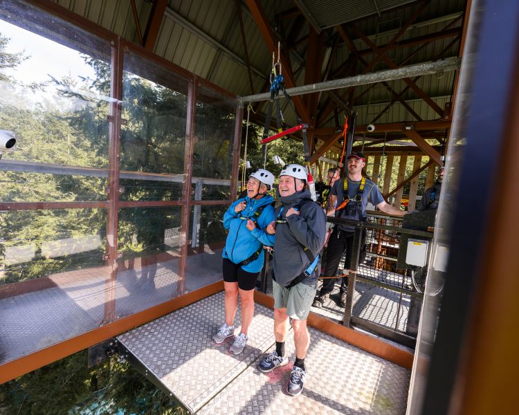 two people at the top of zip world plummet waiting to drop down