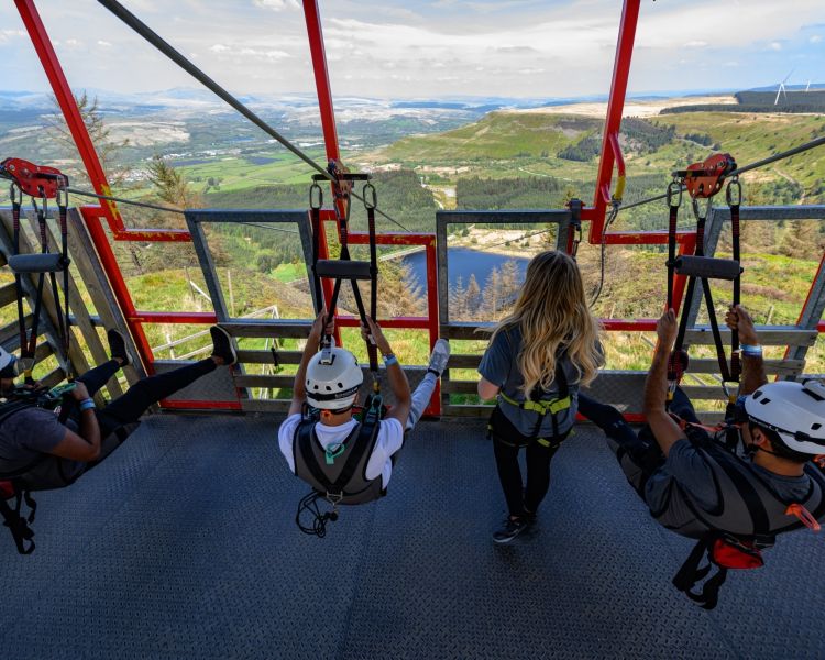 three people ready to go down the zip lines at zip world phoenix
