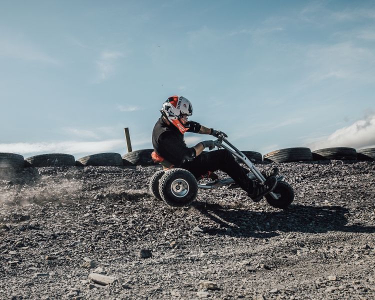 person on the dirt track at zip world quarry karts