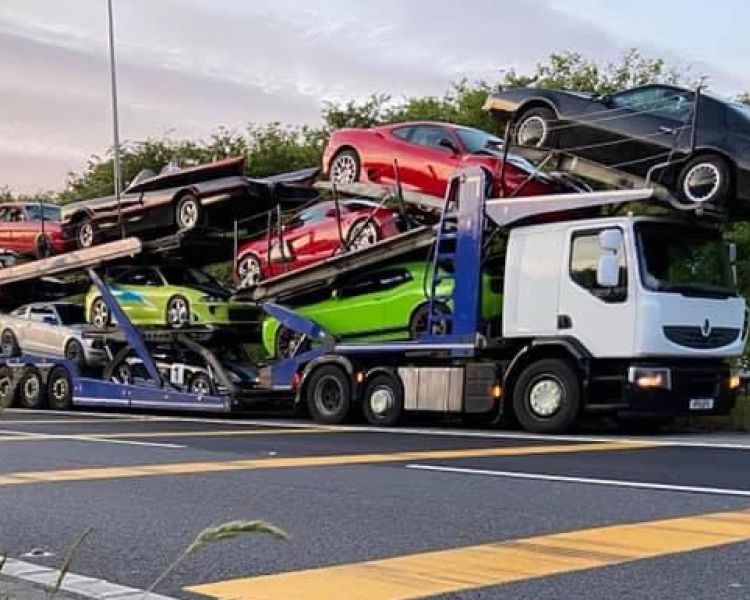 car transporter carrying cars driven on a truck driving experience day
