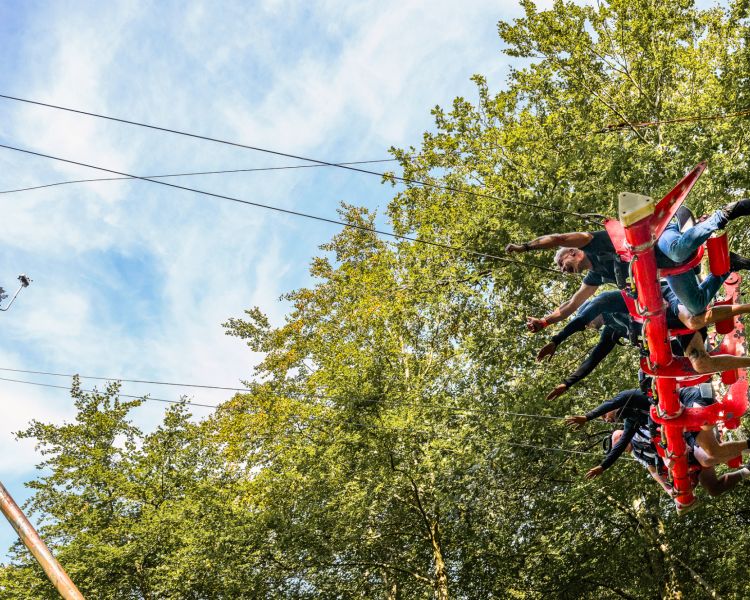 people on the zip world skyride in wales