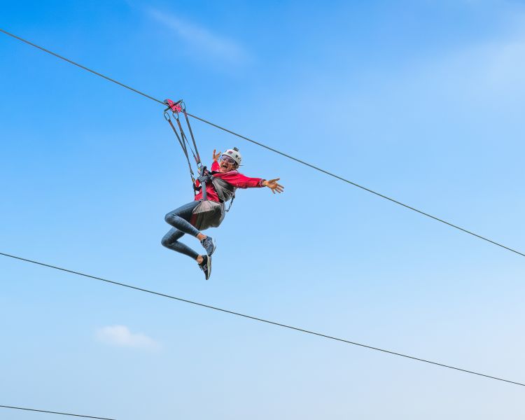 person going down the zip lines at zip world titan in wales
